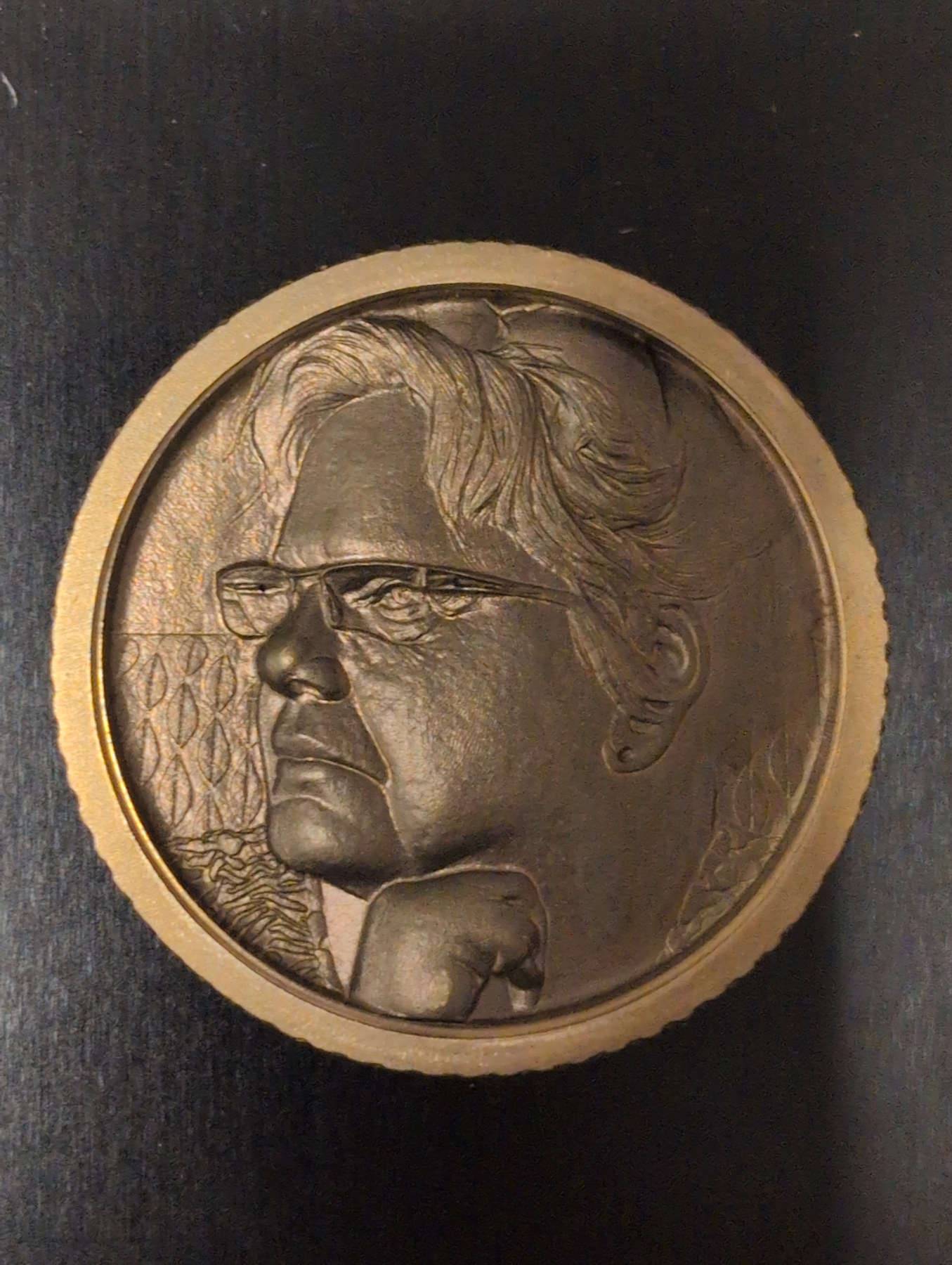 Custom dimensional metal relief portrait of a man wearing glasses